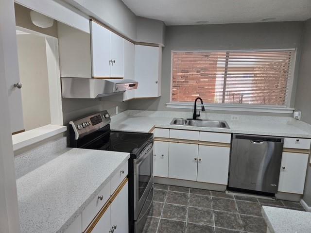 7812 Royal Lane, Unit 210 Dallas, TX 75230 - Photo 4 of 23 a kitchen with a sink stove and cabinets