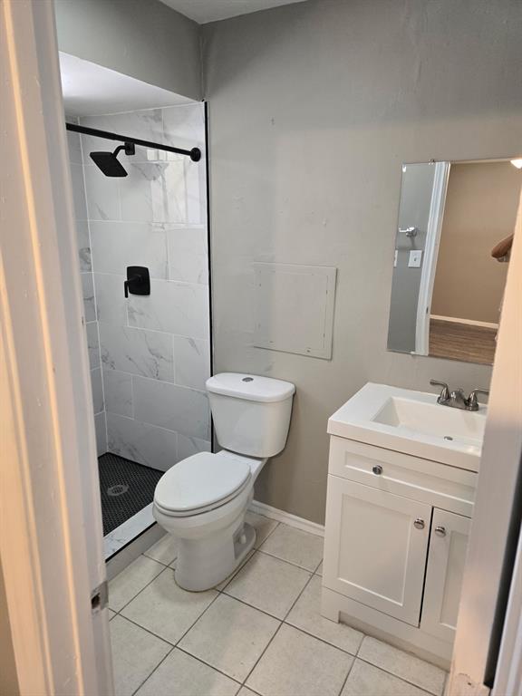 7812 Royal Lane, Unit 210 Dallas, TX 75230 - Photo 9 of 23 a bathroom with a toilet and a shower