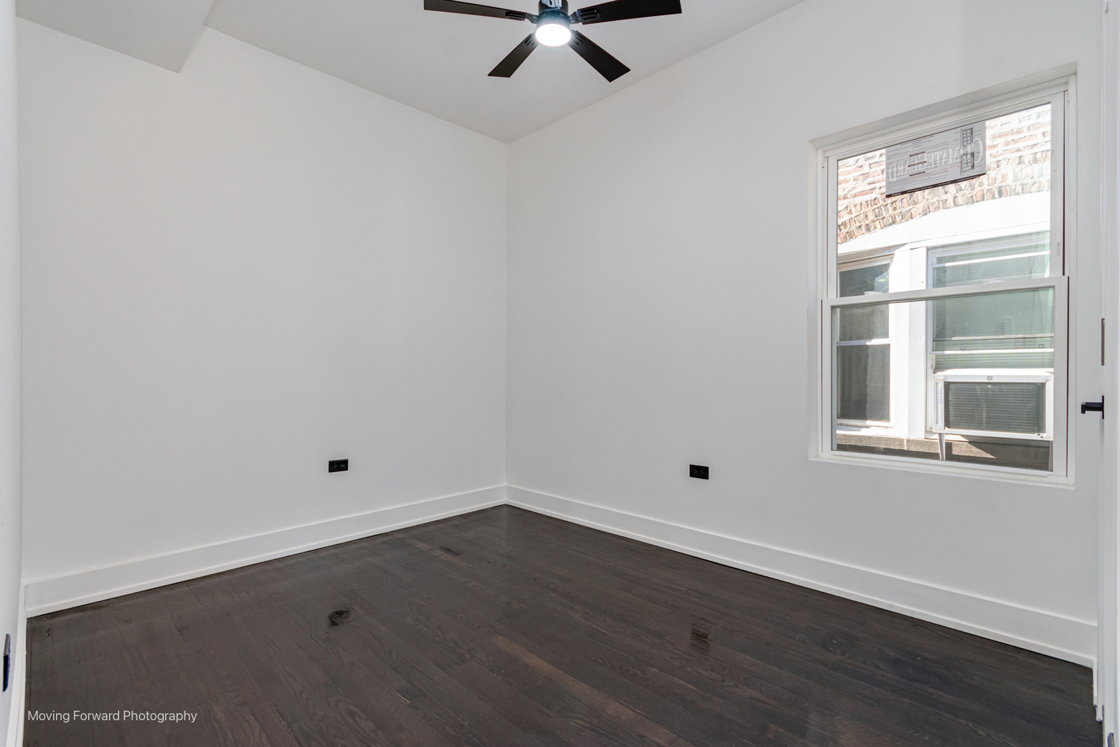 4941 West Iowa Street Chicago, IL 60651 - Photo 11 of 44 a view of a room with wooden floor and windows