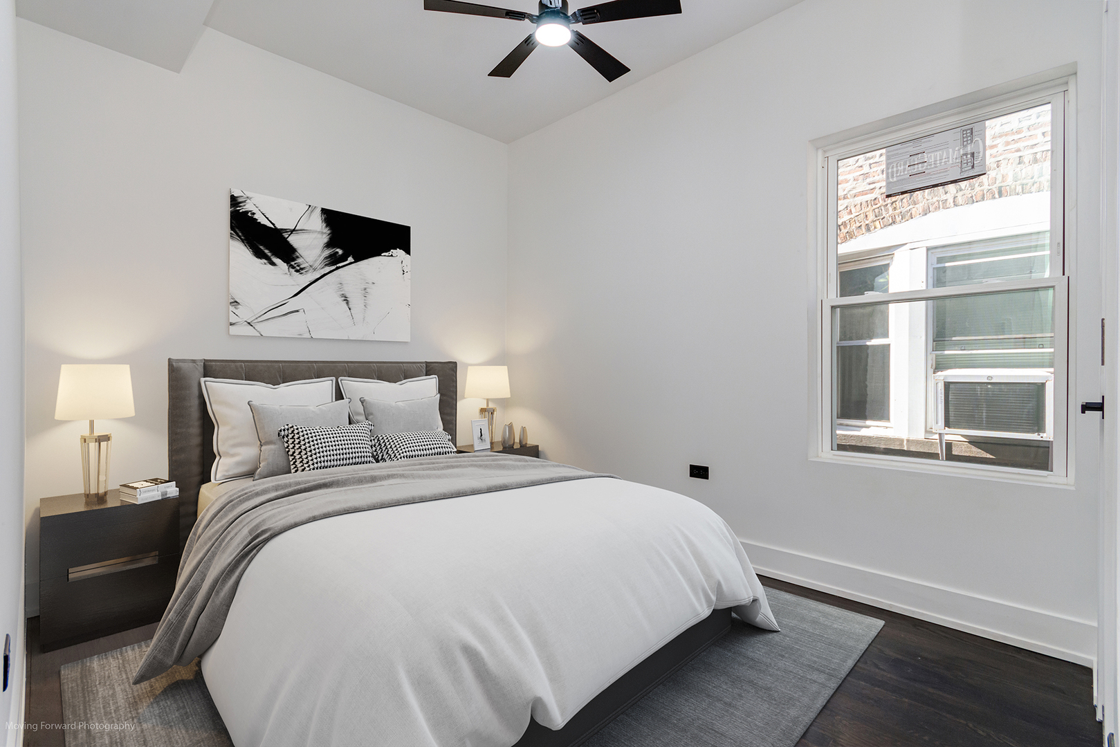 4941 West Iowa Street Chicago, IL 60651 - Photo 12 of 44 a bedroom with a bed and a window