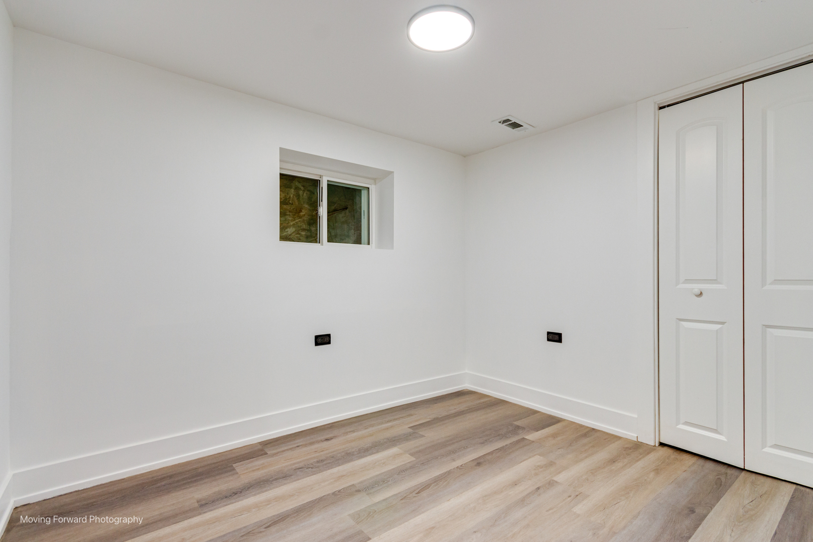 4941 West Iowa Street Chicago, IL 60651 - Photo 18 of 44 a view of an empty room with wooden floor