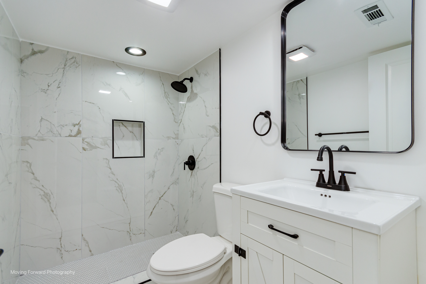 4941 West Iowa Street Chicago, IL 60651 - Photo 20 of 44 a bathroom with a sink a toilet and shower