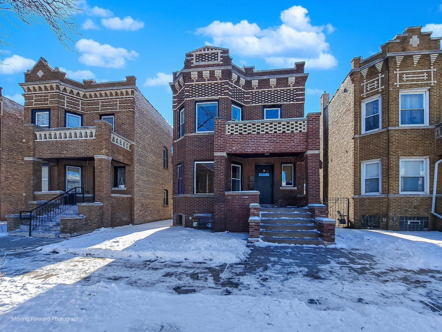 4941 West Iowa Street Chicago, IL 60651 - Photo 2 of 44 a front view of a brick building with many windows