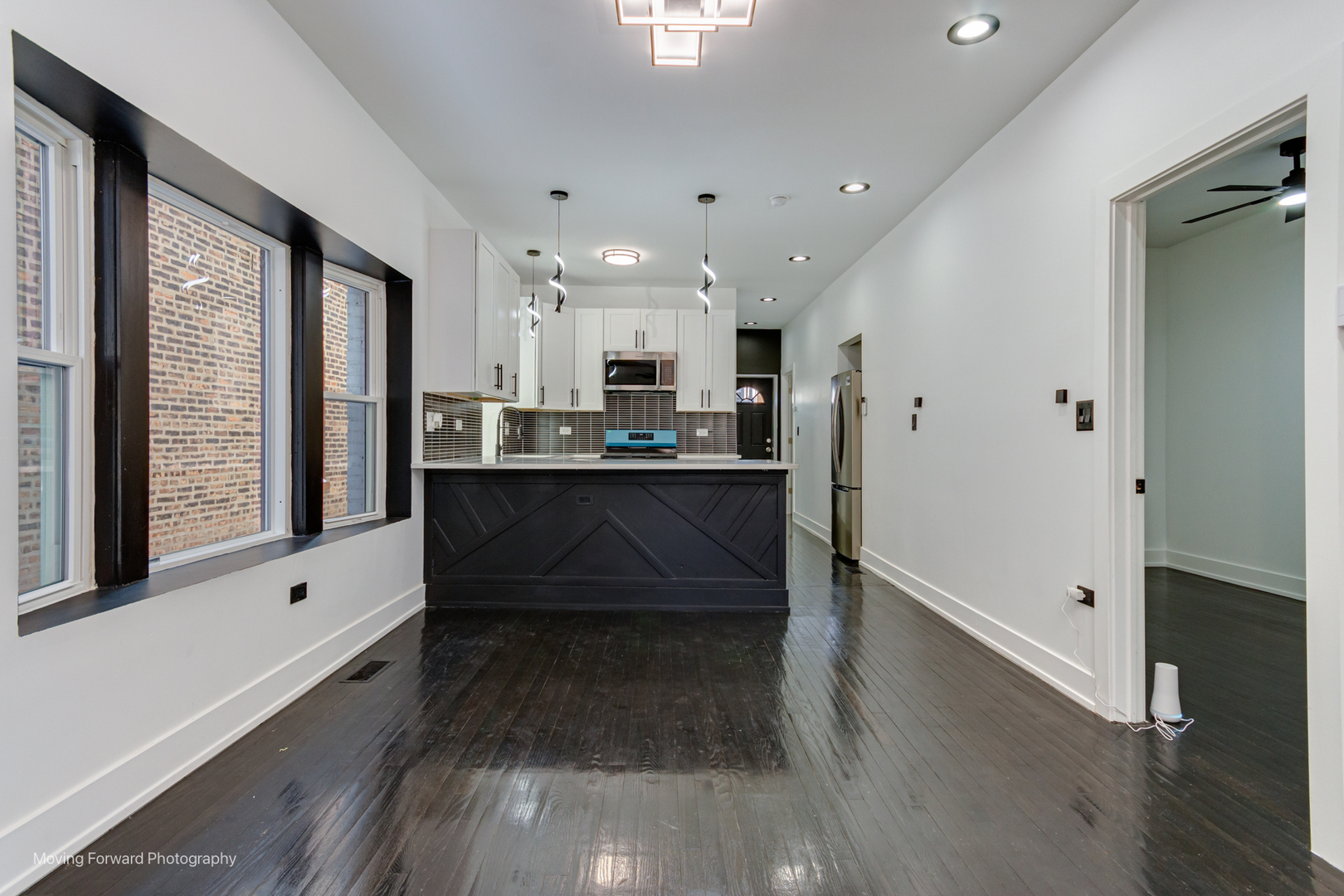 4941 West Iowa Street Chicago, IL 60651 - Photo 25 of 44 a room with stainless steel appliances a large window