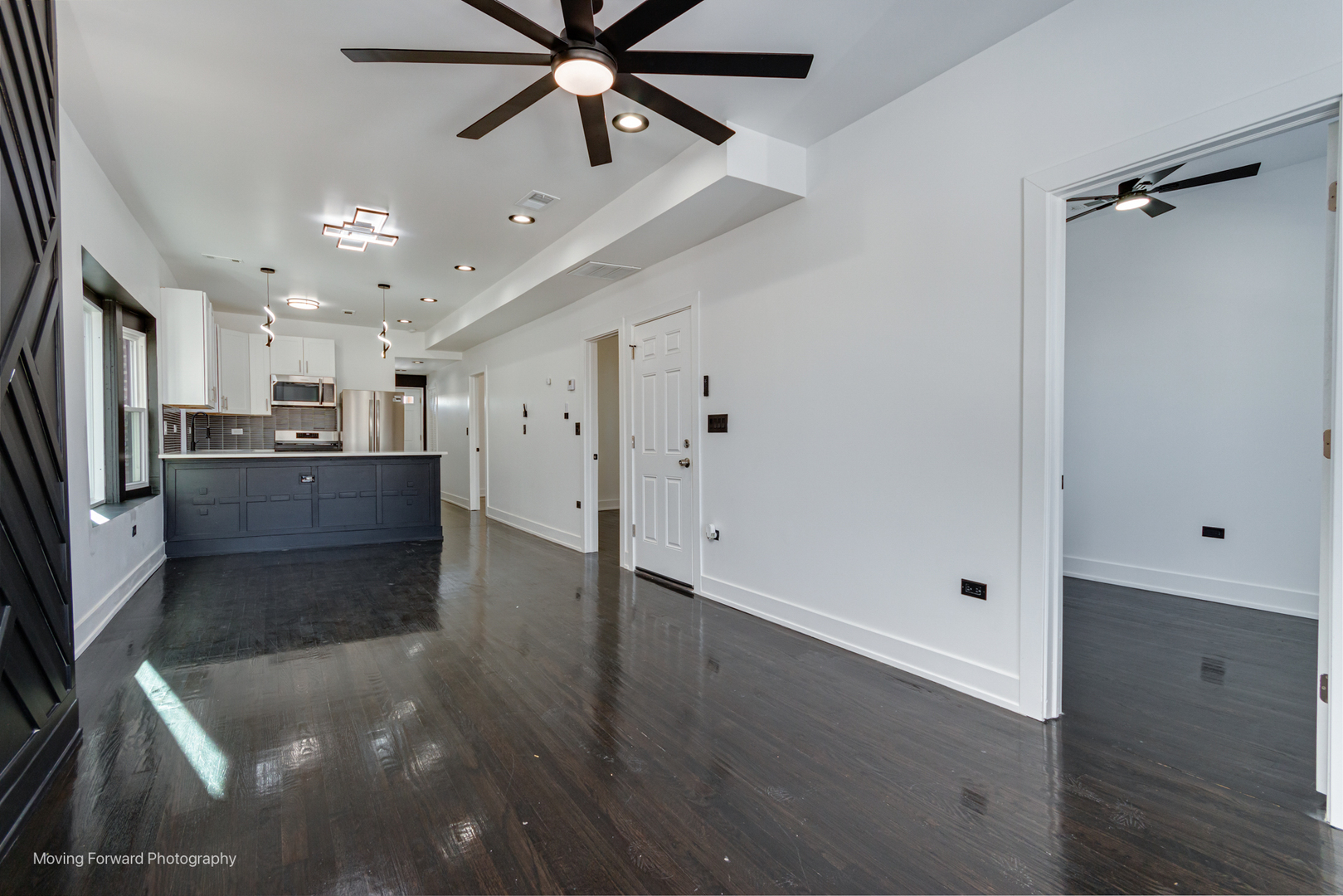 4941 West Iowa Street Chicago, IL 60651 - Photo 28 of 44 a view of a kitchen with a sink and a refrigerator