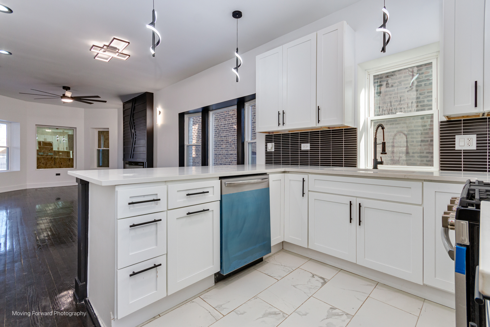4941 West Iowa Street Chicago, IL 60651 - Photo 29 of 44 a kitchen with white cabinets and appliances