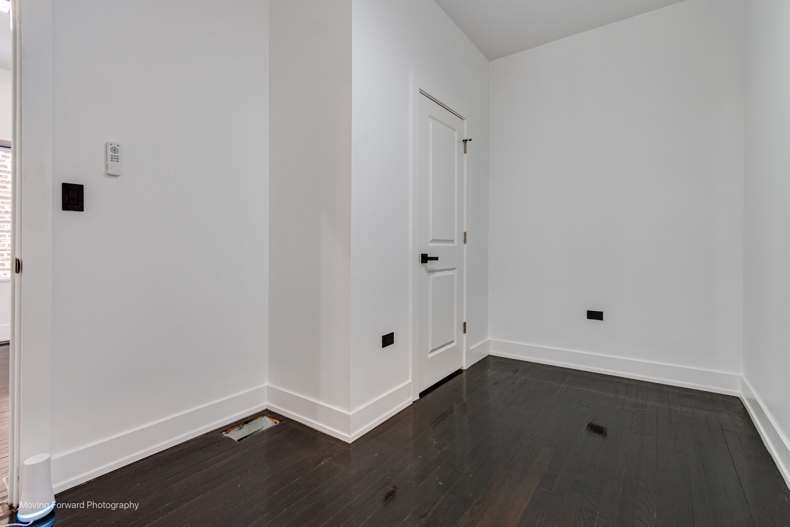 4941 West Iowa Street Chicago, IL 60651 - Photo 31 of 44 a view of room with window and wooden floor