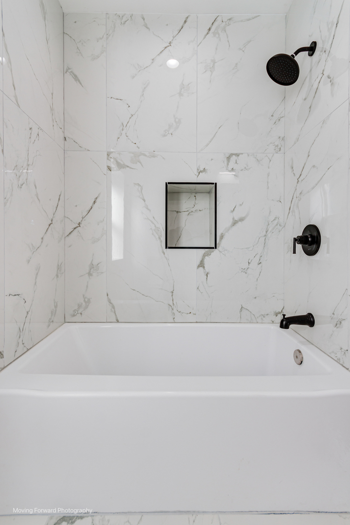 4941 West Iowa Street Chicago, IL 60651 - Photo 37 of 44 a bathroom with a bathtub