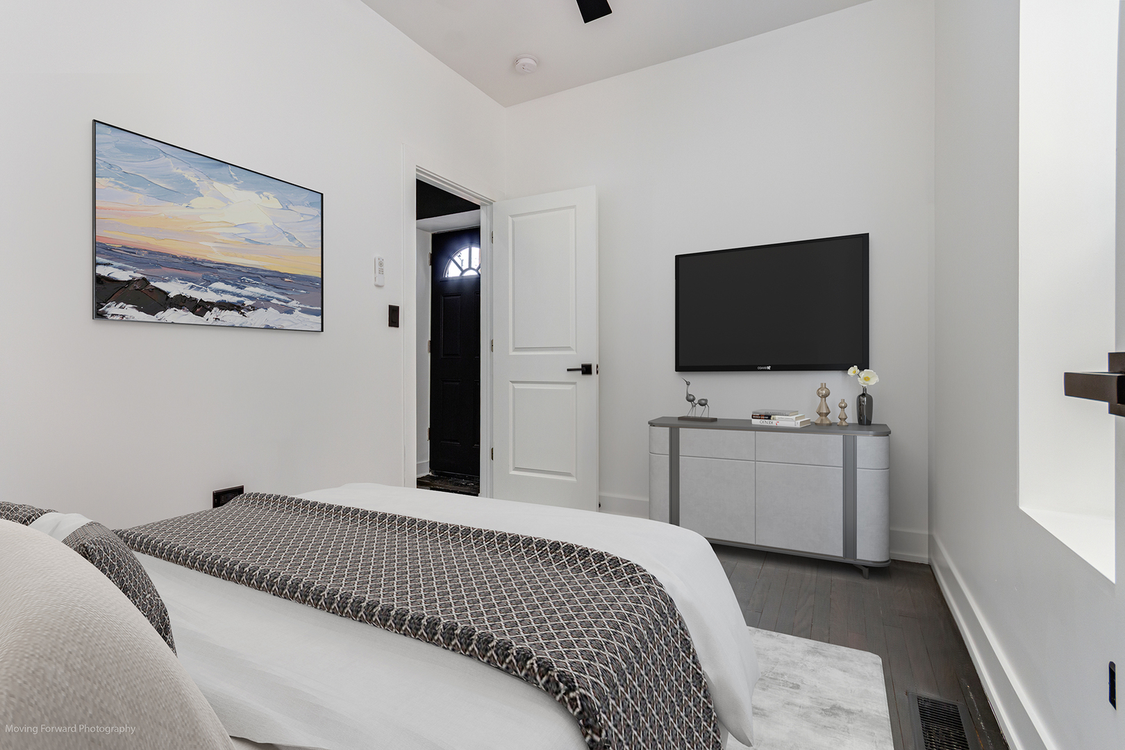 4941 West Iowa Street Chicago, IL 60651 - Photo 39 of 44 a bedroom with a bed and a flat screen tv