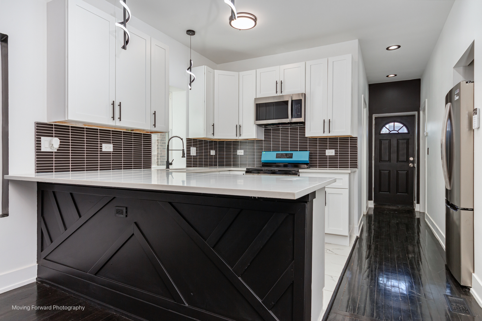 4941 West Iowa Street Chicago, IL 60651 - Photo 10 of 44 a kitchen with stainless steel appliances a refrigerator sink and cabinets