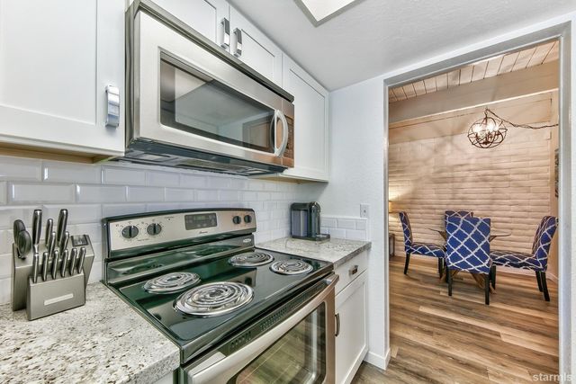 a kitchen with a stove and a microwave