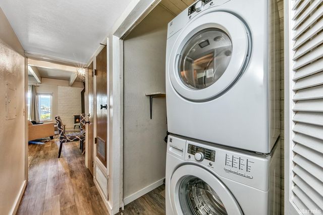 a view of a hallway with washer and dryer