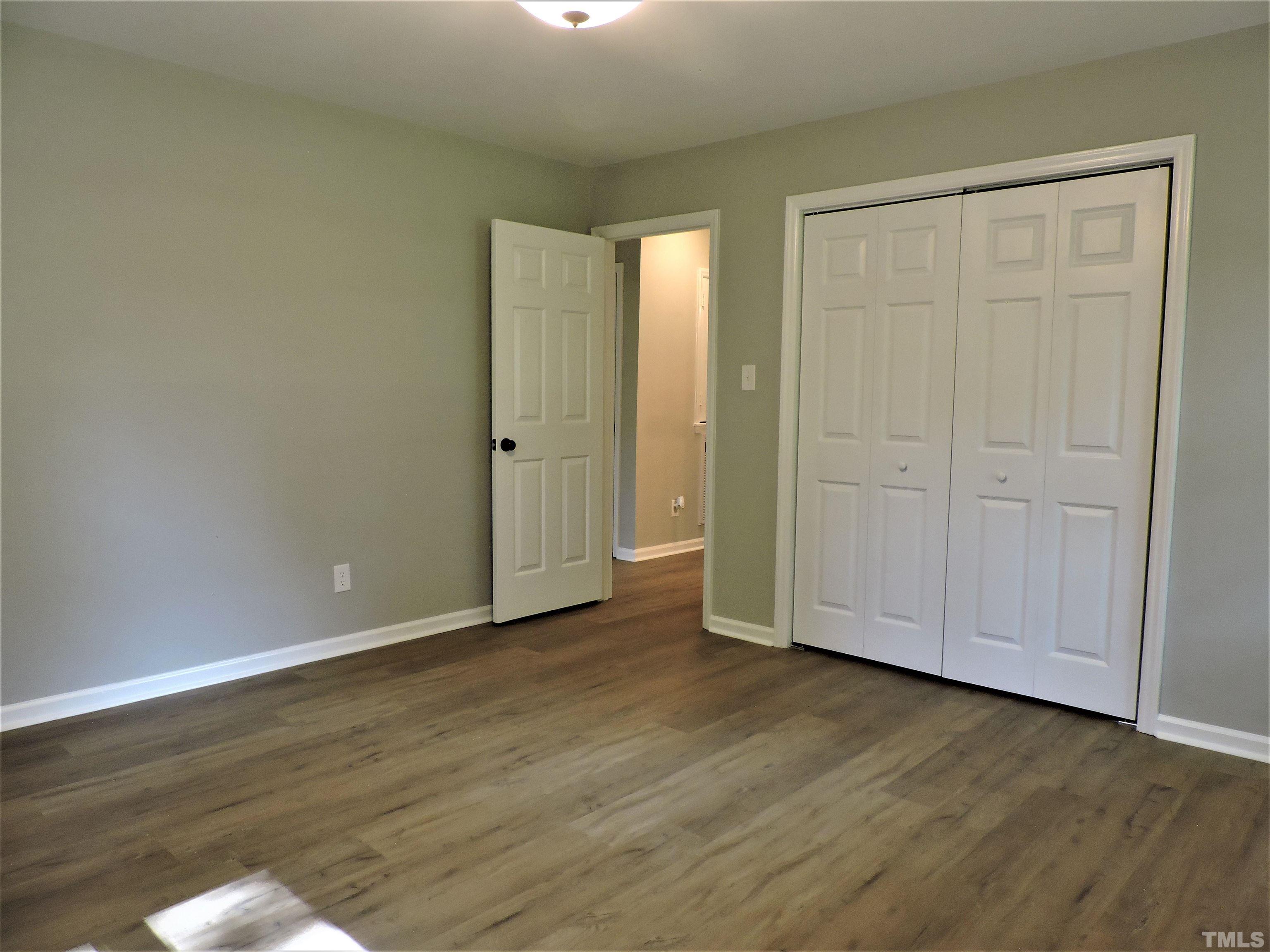 1513 Ridge Lane Hillsborough, NC 27278 - Photo 13 of 24 a view of an empty room with wooden floor