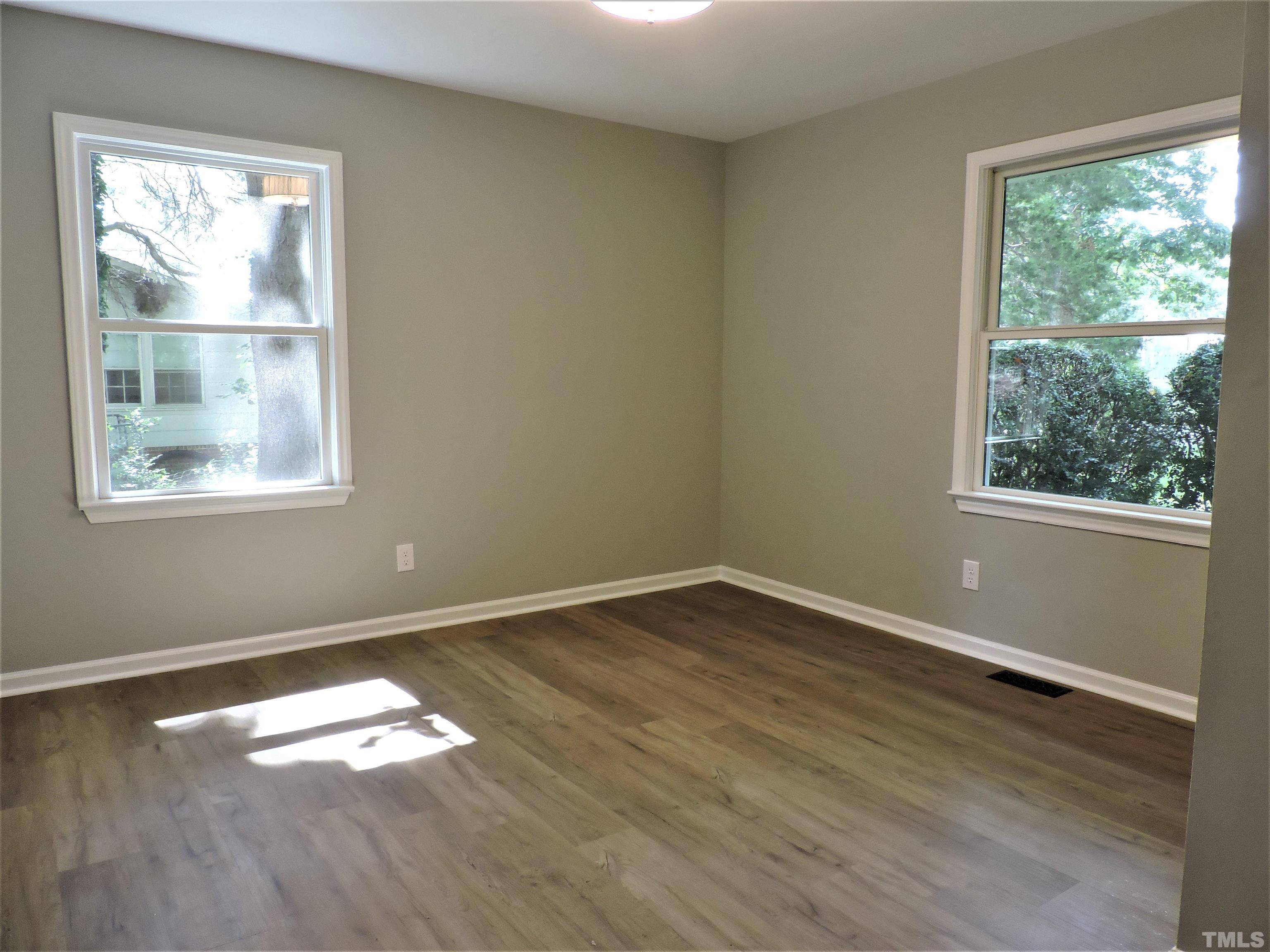 1513 Ridge Lane Hillsborough, NC 27278 - Photo 14 of 24 an empty room with wooden floor and windows
