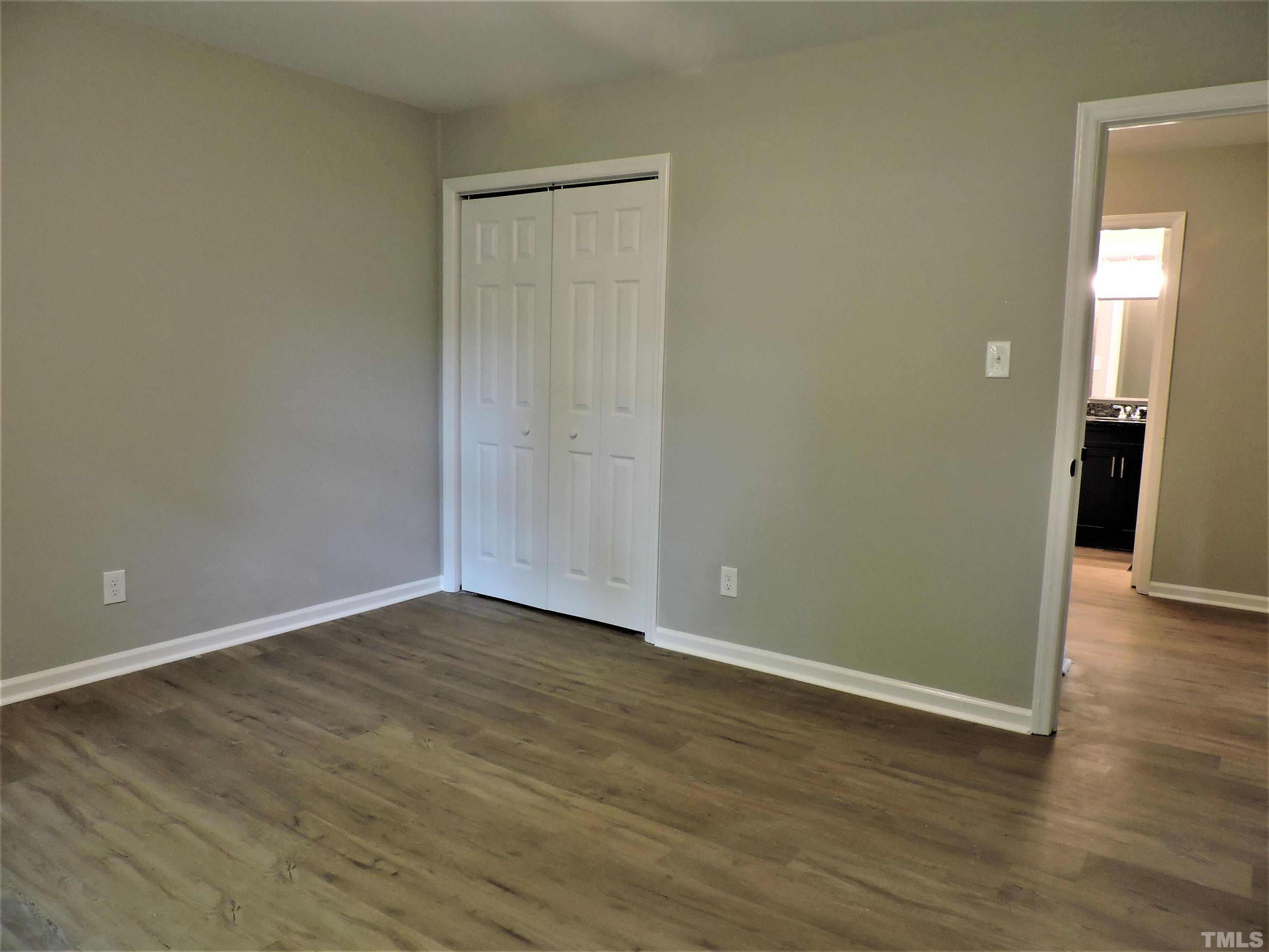1513 Ridge Lane Hillsborough, NC 27278 - Photo 17 of 24 a view of an empty room with wooden floor and closet