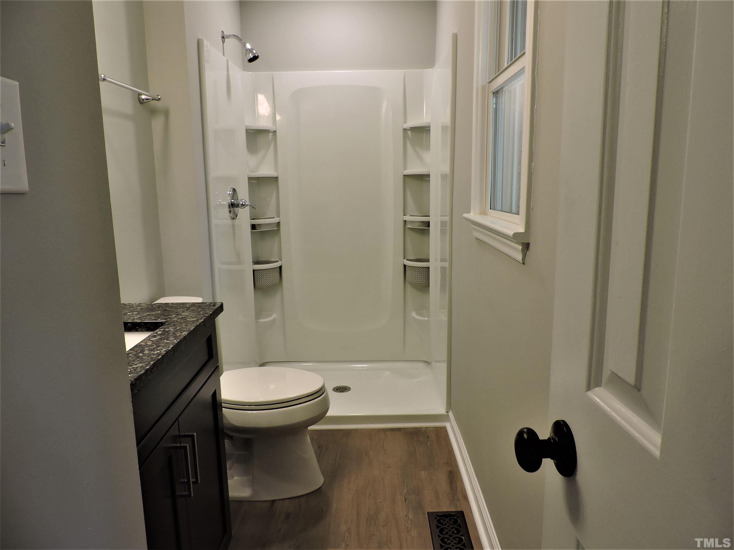 1513 Ridge Lane Hillsborough, NC 27278 - Photo 18 of 24 a bathroom with a toilet and a shower