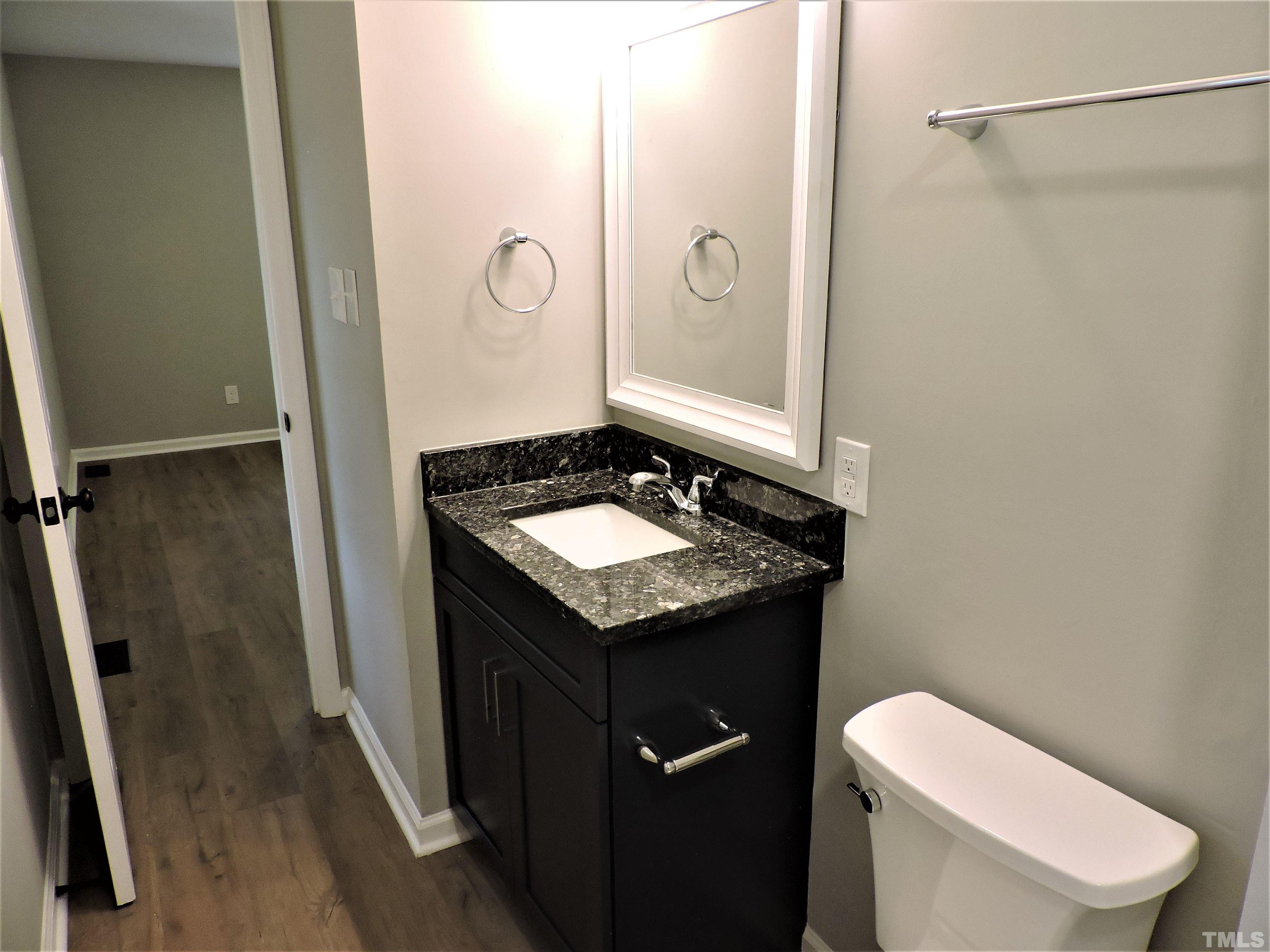 1513 Ridge Lane Hillsborough, NC 27278 - Photo 19 of 24 a bathroom with a granite countertop sink toilet and shower