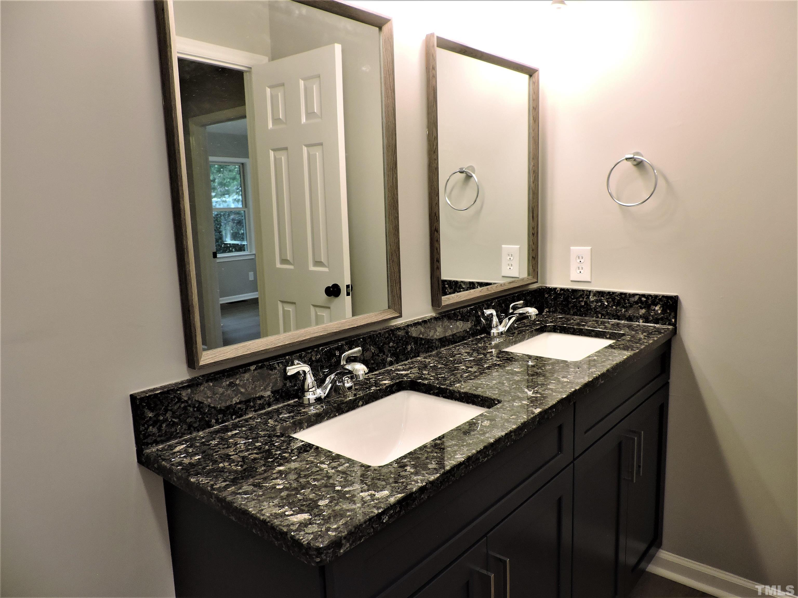 1513 Ridge Lane Hillsborough, NC 27278 - Photo 21 of 24 a bathroom with double sink and a mirror