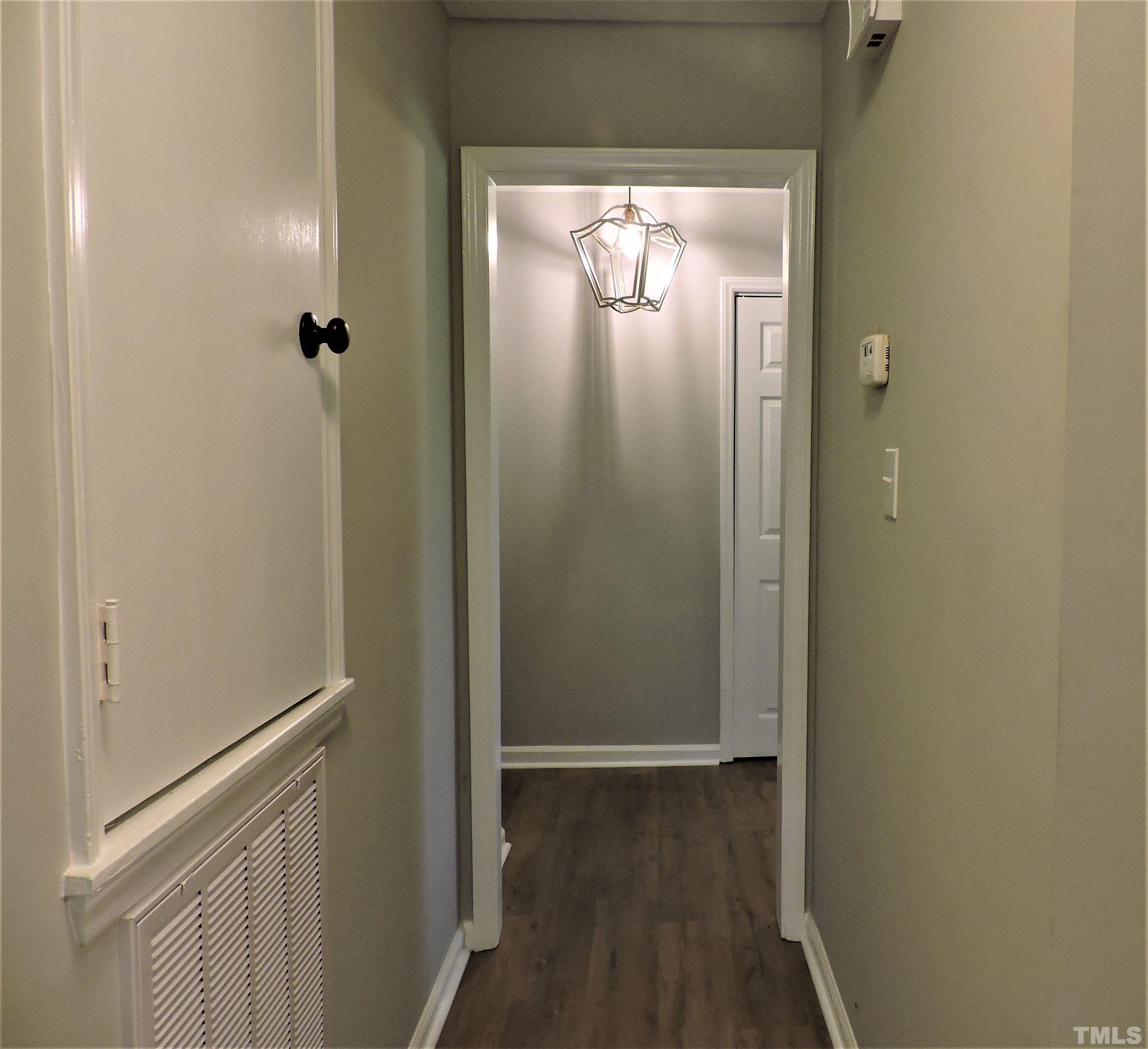 1513 Ridge Lane Hillsborough, NC 27278 - Photo 22 of 24 a view of a hallway with wooden floor