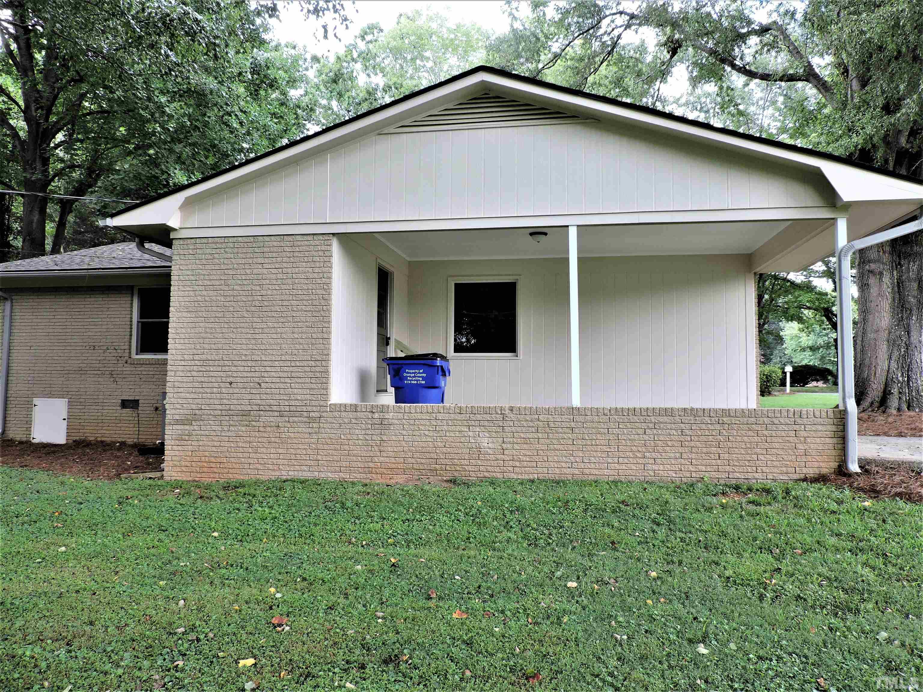 1513 Ridge Lane Hillsborough, NC 27278 - Photo 6 of 24 a front view of a house with a yard and garage