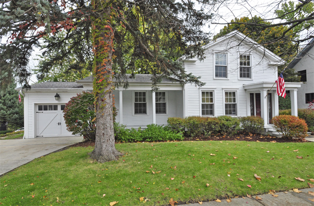 527 North Sheridan Road Waukegan, IL 60085 - Photo 1 of 25 a front view of a house with a yard and trees