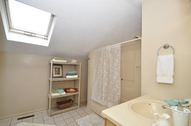 527 North Sheridan Road Waukegan, IL 60085 - Photo 14 of 25 a bathroom with a sink and a mirror