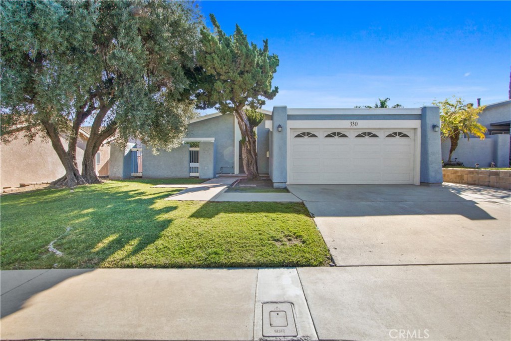 330 South Rock River Road Diamond Bar, CA 91765 - Photo 1 of 1 a view of a house with a yard and a garage