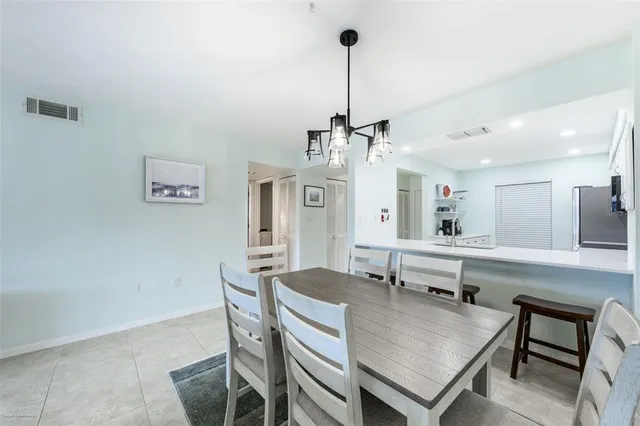 a view of a kitchen with a table and chairs