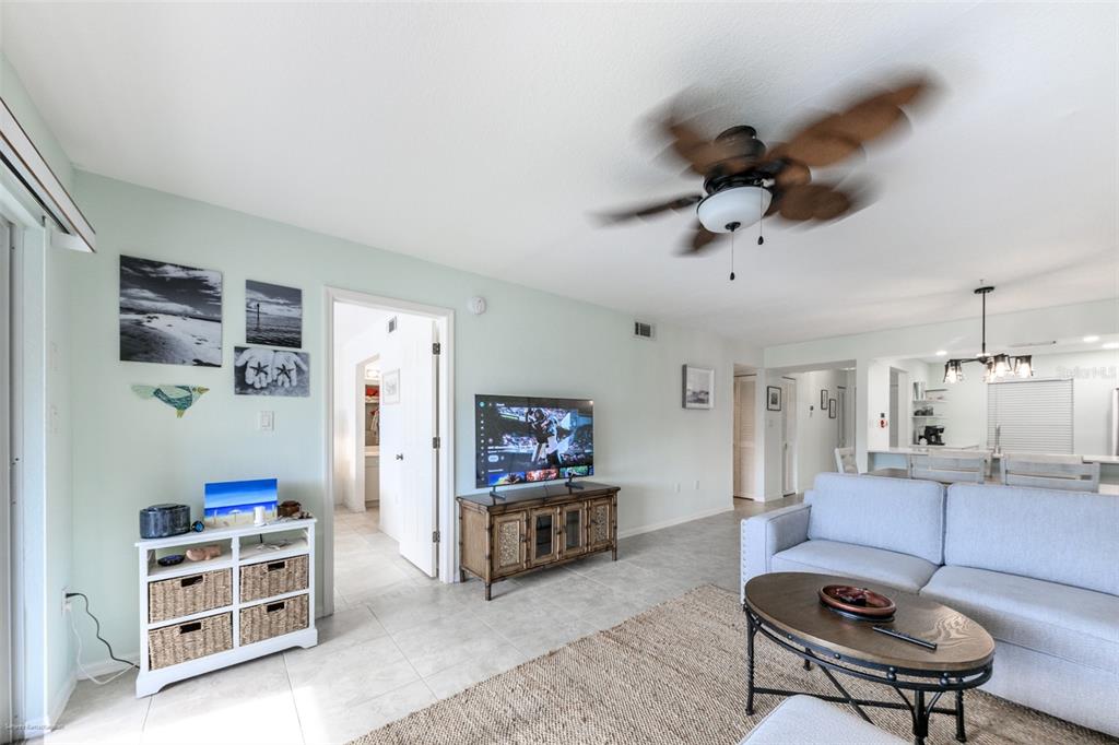 220 Coldeway Drive, Unit 112 Punta Gorda, FL 33950 - Photo 19 of 49 a living room with furniture and a kitchen