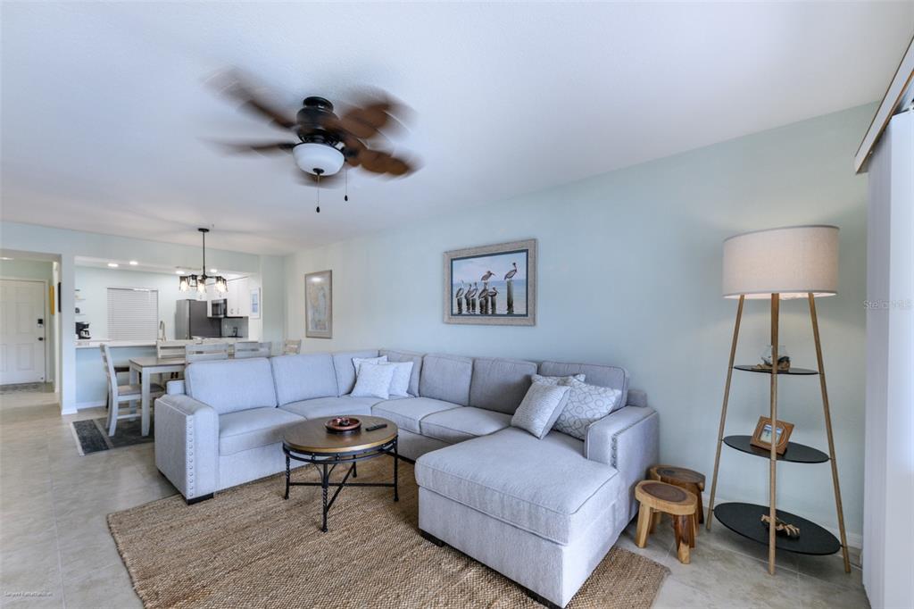 220 Coldeway Drive, Unit 112 Punta Gorda, FL 33950 - Photo 20 of 49 a living room with furniture and a lamp