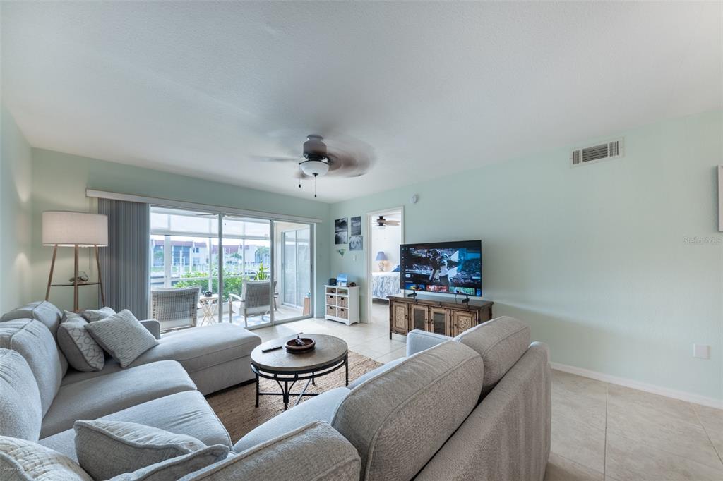 220 Coldeway Drive, Unit 112 Punta Gorda, FL 33950 - Photo 22 of 49 a living room with furniture and a large window