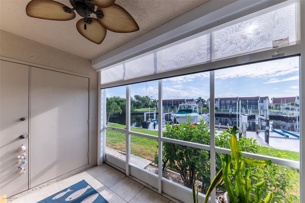 220 Coldeway Drive, Unit 112 Punta Gorda, FL 33950 - Photo 23 of 49 a view of a chairs and table in the balcony