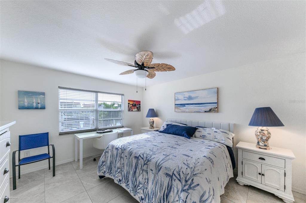 220 Coldeway Drive, Unit 112 Punta Gorda, FL 33950 - Photo 25 of 49 a bedroom with a large bed and a window