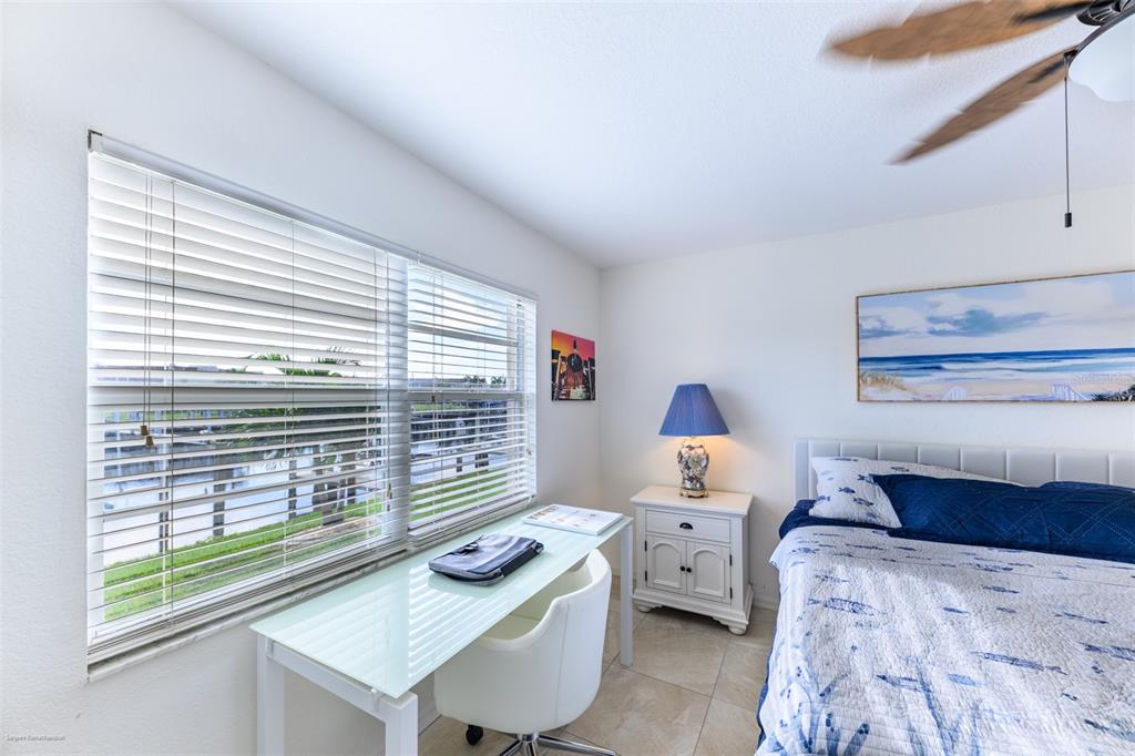 220 Coldeway Drive, Unit 112 Punta Gorda, FL 33950 - Photo 28 of 49 a bedroom with a bed and a window