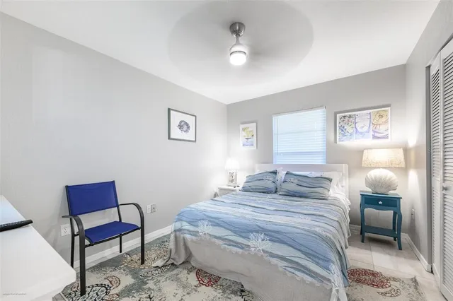 a bedroom with a bed and a chair