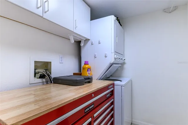 a bedroom with a bed and cabinets