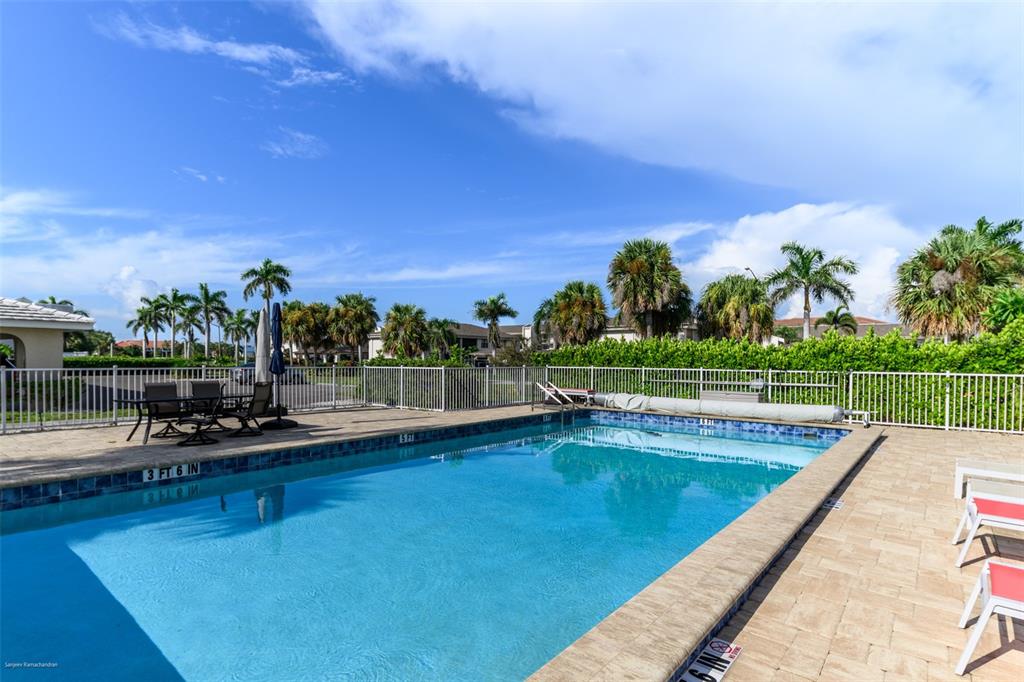 220 Coldeway Drive, Unit 112 Punta Gorda, FL 33950 - Photo 46 of 49 a view of a swimming pool with a patio and a yard