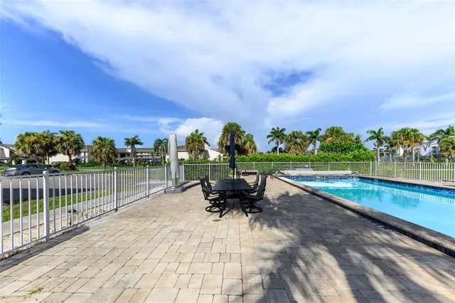 a front view of a house with a garden and plants
