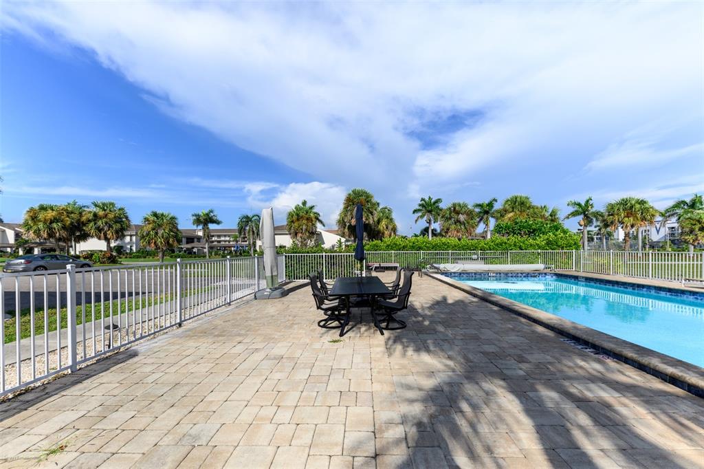 220 Coldeway Drive, Unit 112 Punta Gorda, FL 33950 - Photo 48 of 49 a view of a swimming pool and outdoor seating