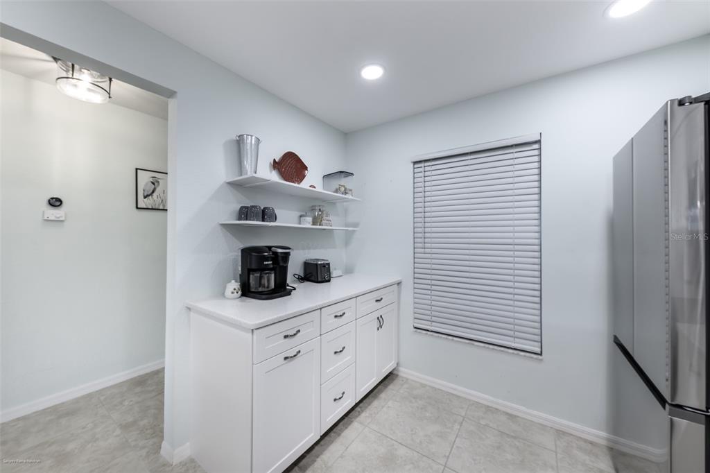 220 Coldeway Drive, Unit 112 Punta Gorda, FL 33950 - Photo 8 of 49 a kitchen with stainless steel appliances cabinets and a window