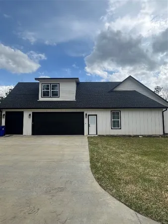 a front view of a house with yard