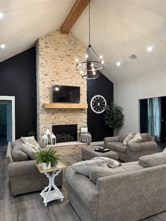a living room with furniture and a fireplace