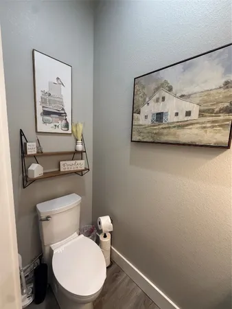 a bathroom with a toilet and a sink