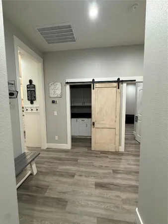 a view of empty room with wooden cabinet