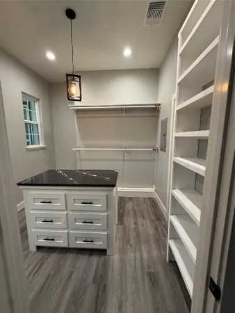 a view of an empty walk in closet