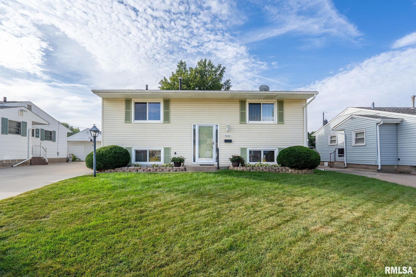a view of a house with a back yard