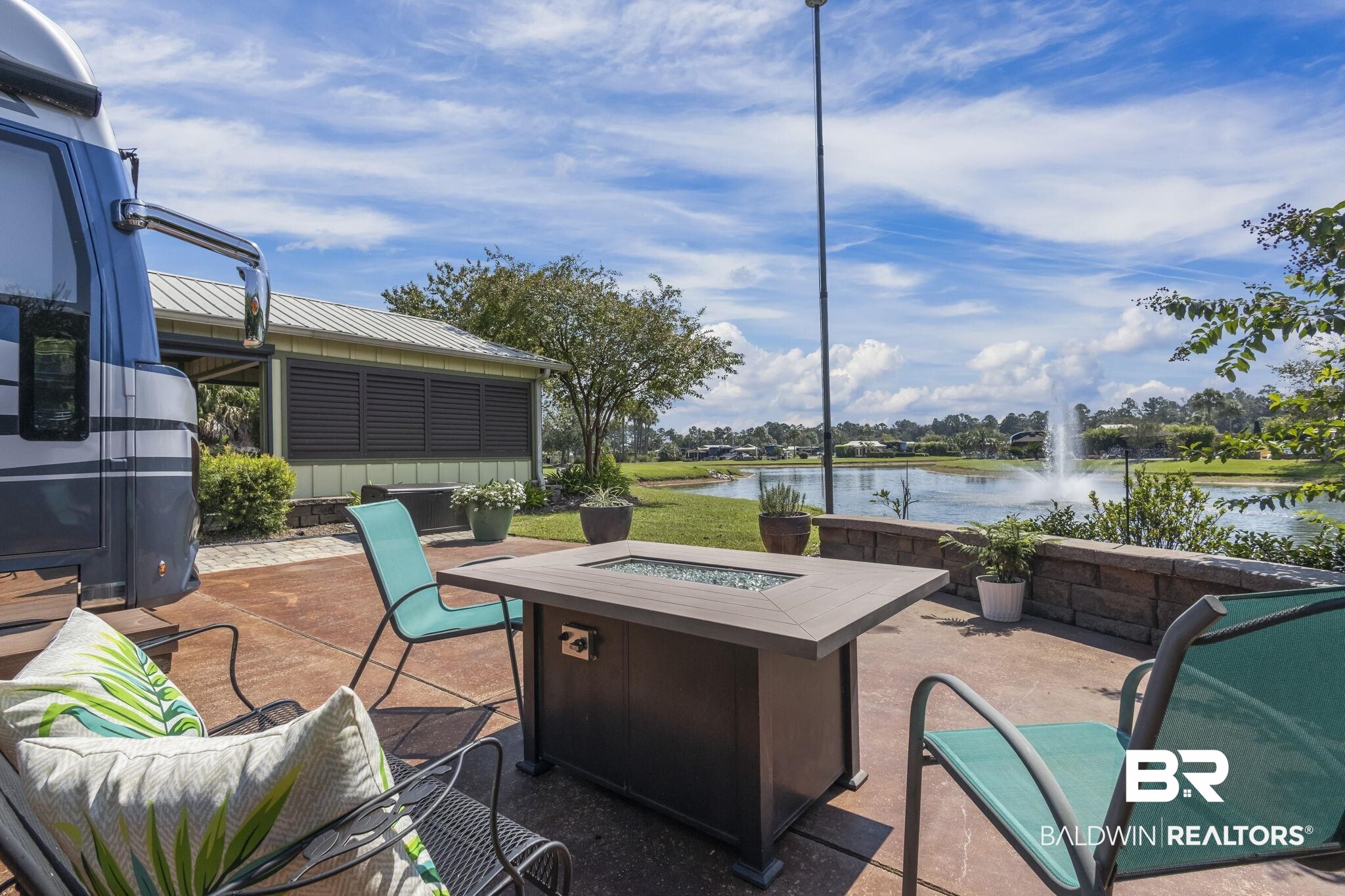 212 Magnifico Drive Foley, AL 36535 - Photo 10 of 50 View of patio / terrace with a water view