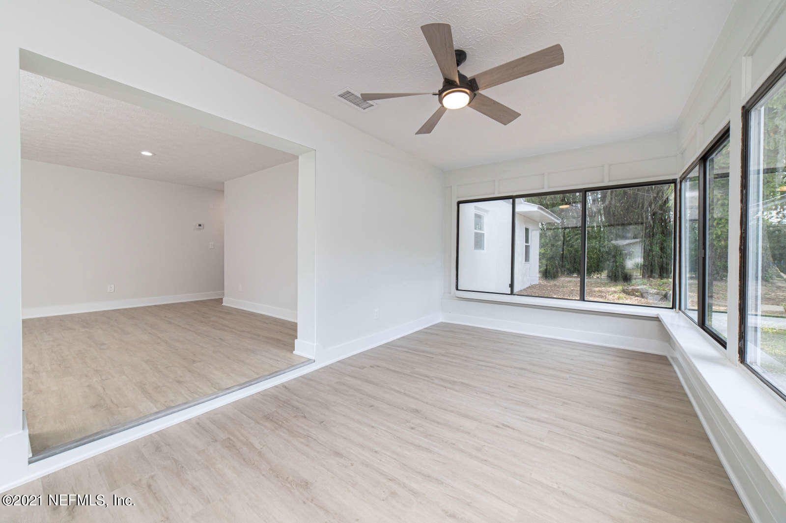 108 Linden Road St. Augustine, FL 32086 - Photo 16 of 36 a view of empty room with wooden floor and fan