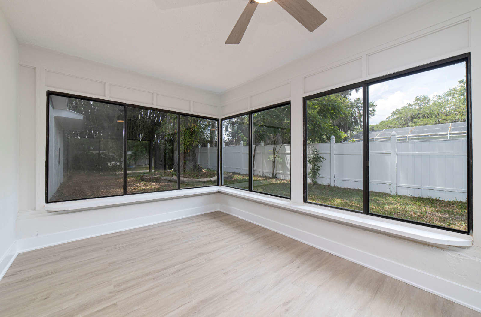 108 Linden Road St. Augustine, FL 32086 - Photo 17 of 36 a view of an empty room with wooden floor and a window