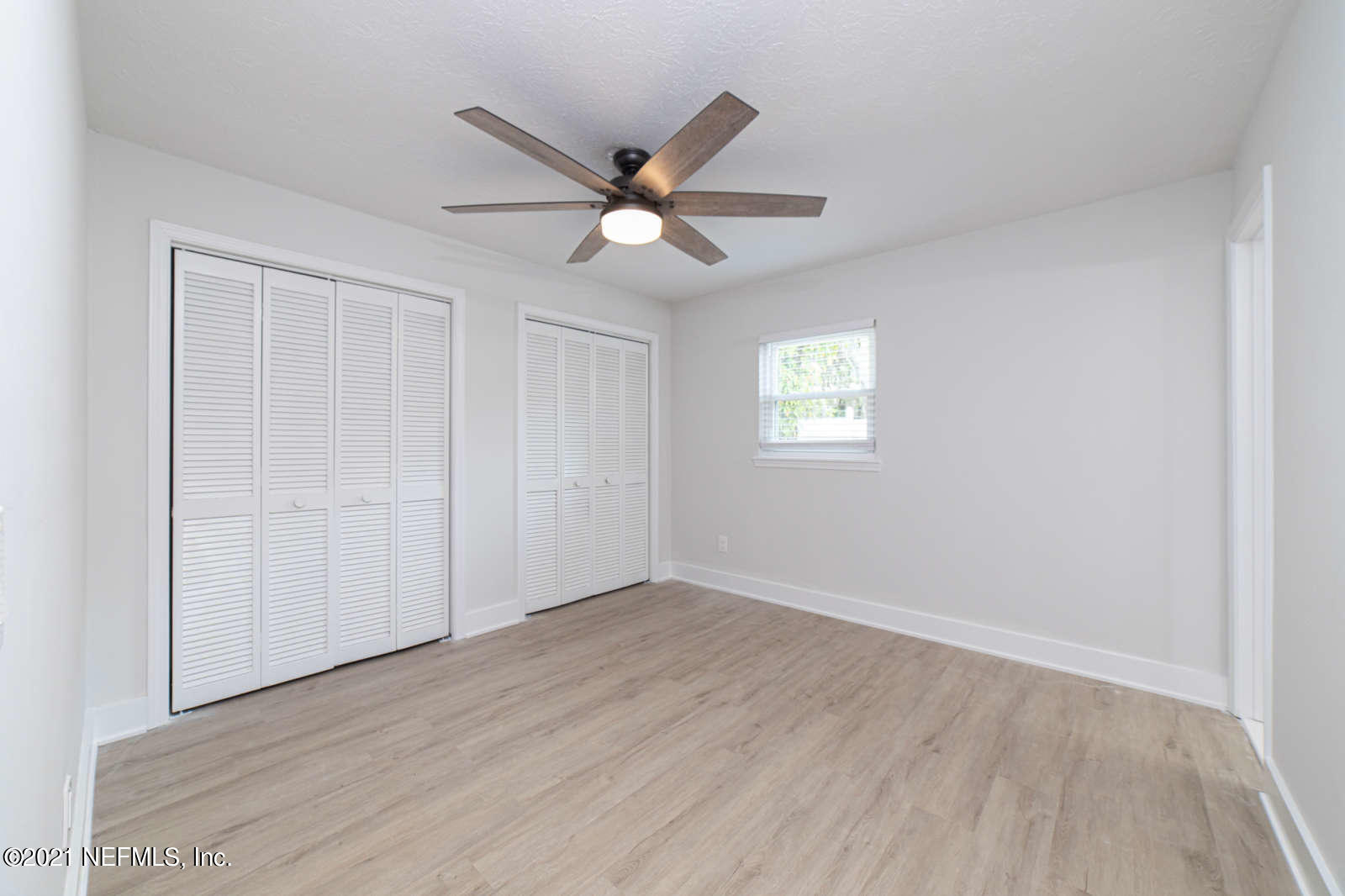 108 Linden Road St. Augustine, FL 32086 - Photo 18 of 36 wooden floor in an empty room with a window